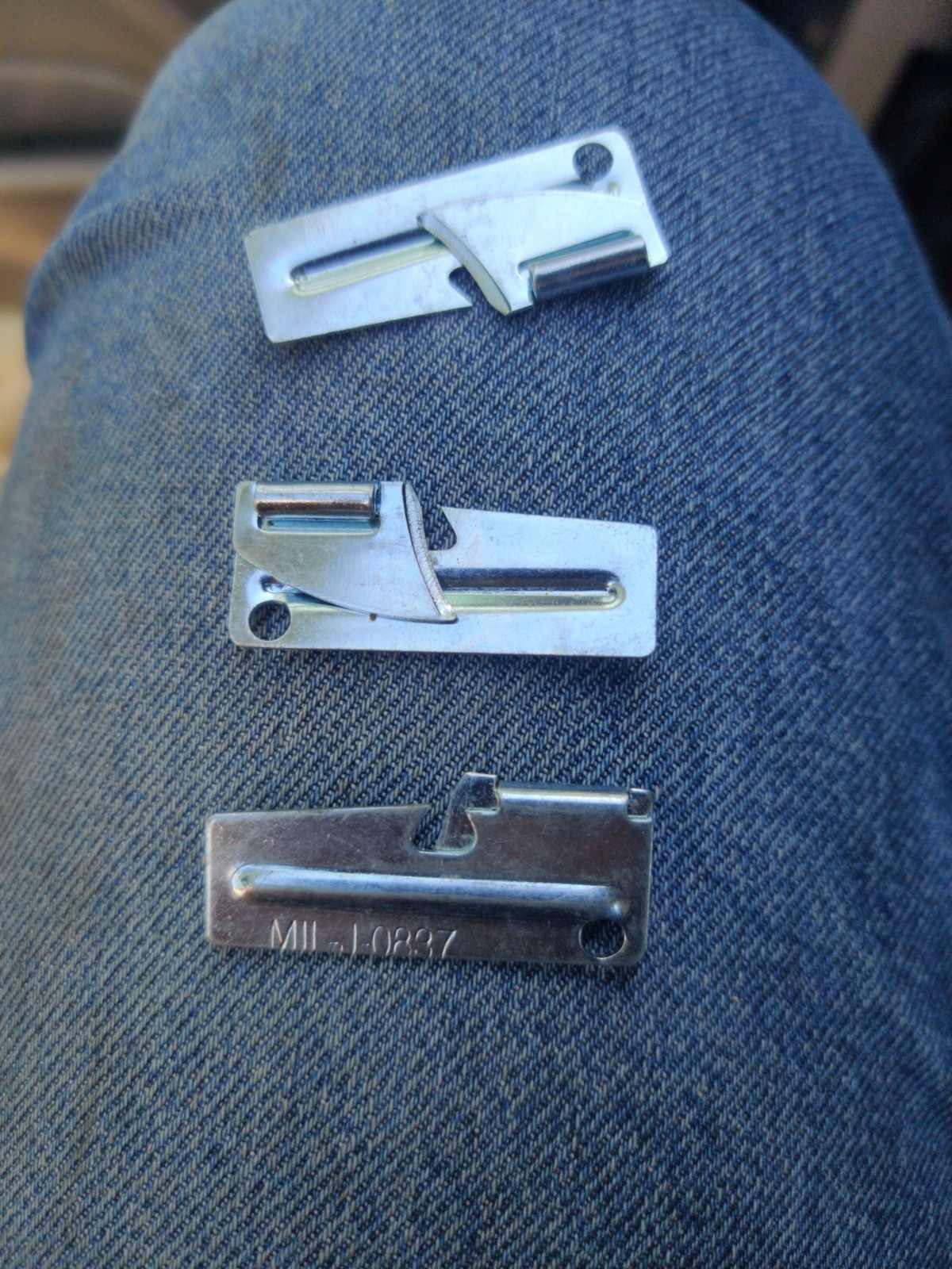 P-38 or P-51 military-style can openers, often known as “John Wayne” openers.
