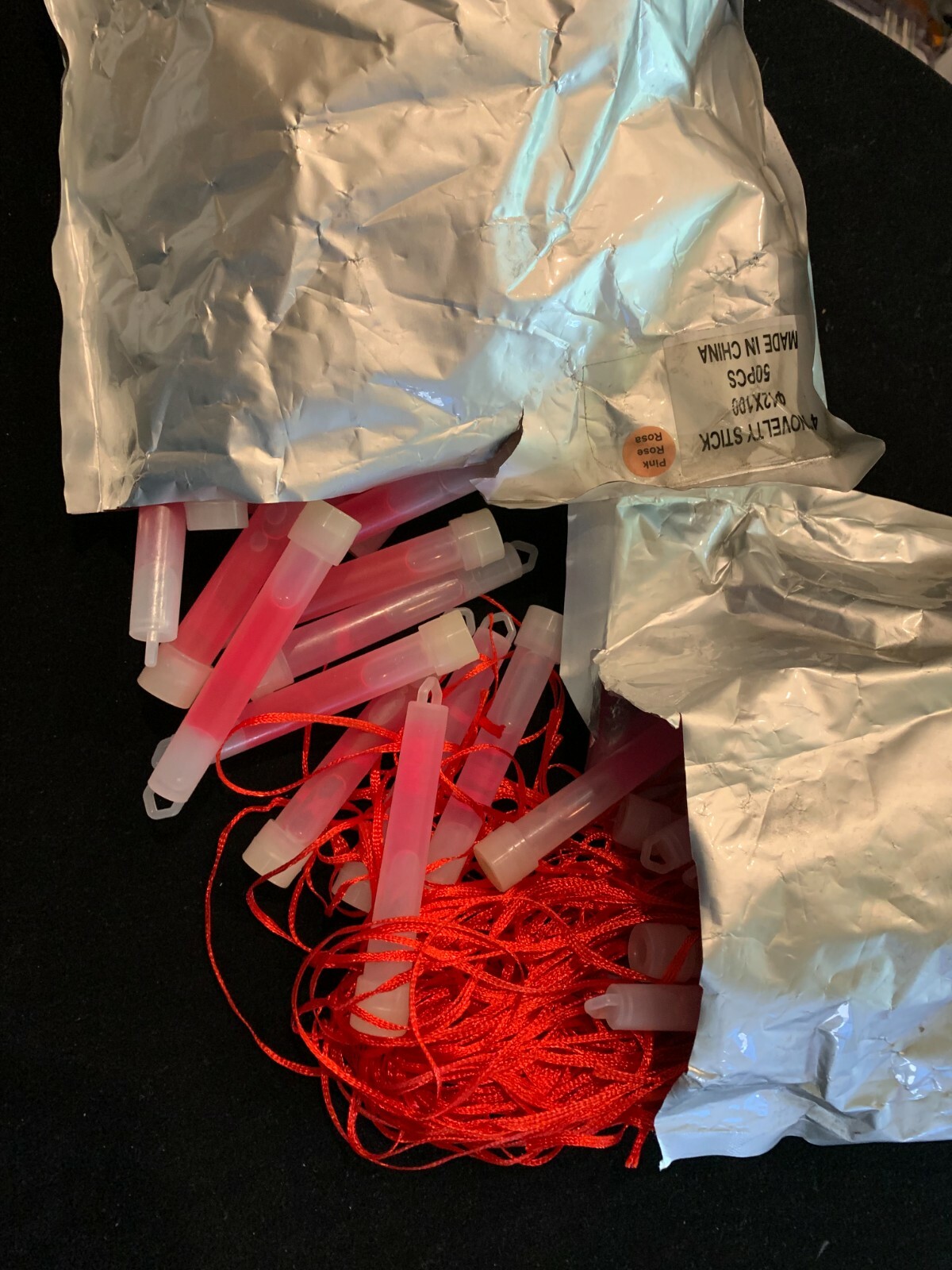 4″ Glo-in-the-Dark Stick Purple & Rose Pink (2 open pkgs) – with red neck string