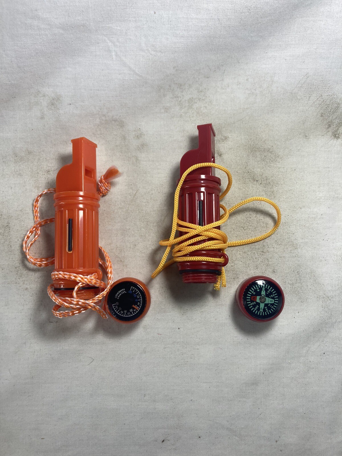 Two Survival Compass, Whistle + Match Holder And Wind Up Survival Flashlight