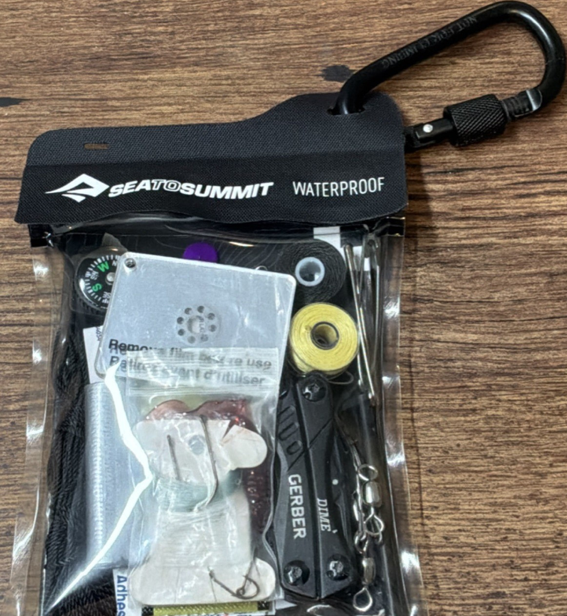 Waterproof Survival Kit with First Aid Guide, Compass, Multi-tool & Much More
