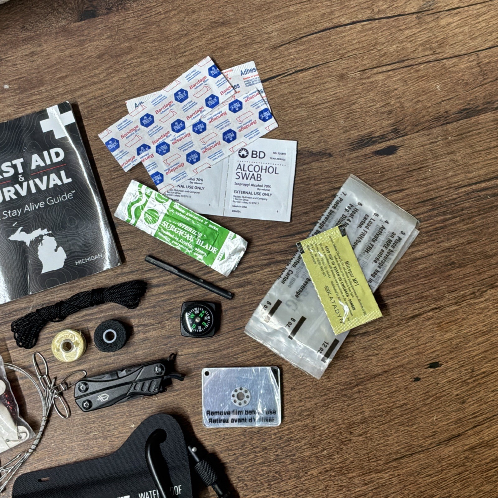 Waterproof Survival Kit with First Aid Guide, Compass, Multi-tool & Much More