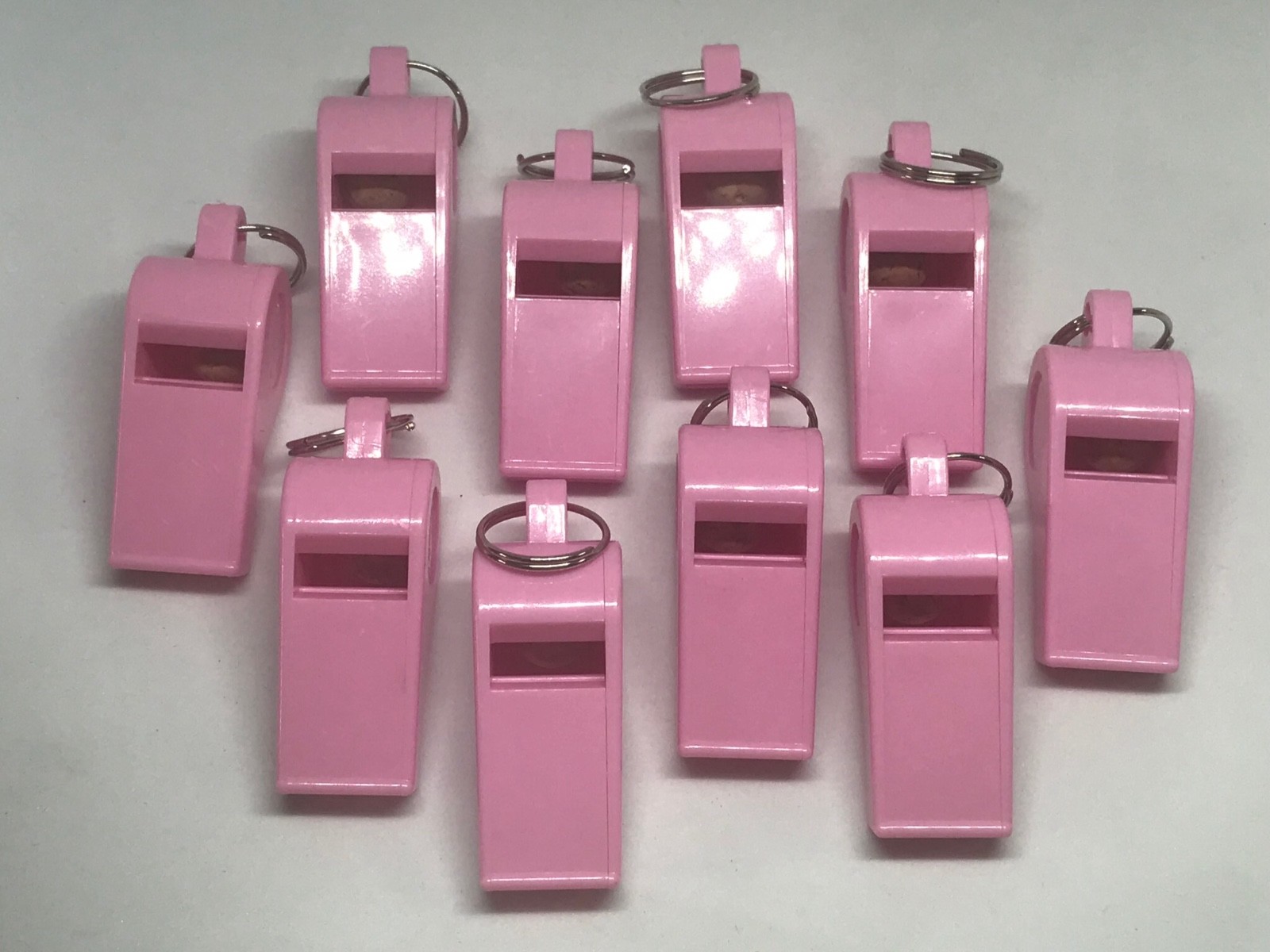 big loud pink plastic whistles 12 pieces