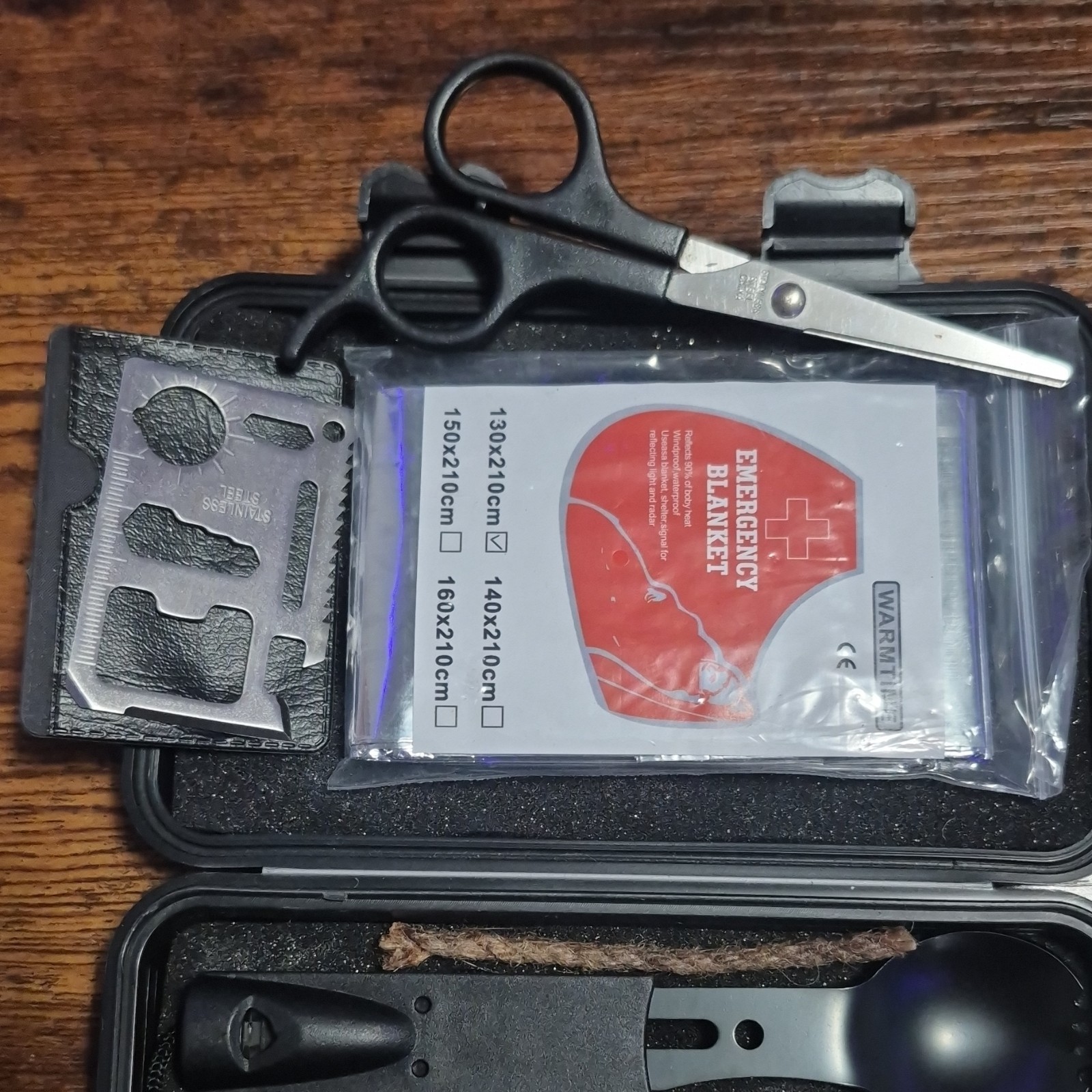 Survival Kit with Emergency Blanket, Multipurpose Tool, Fire Starter, Compass